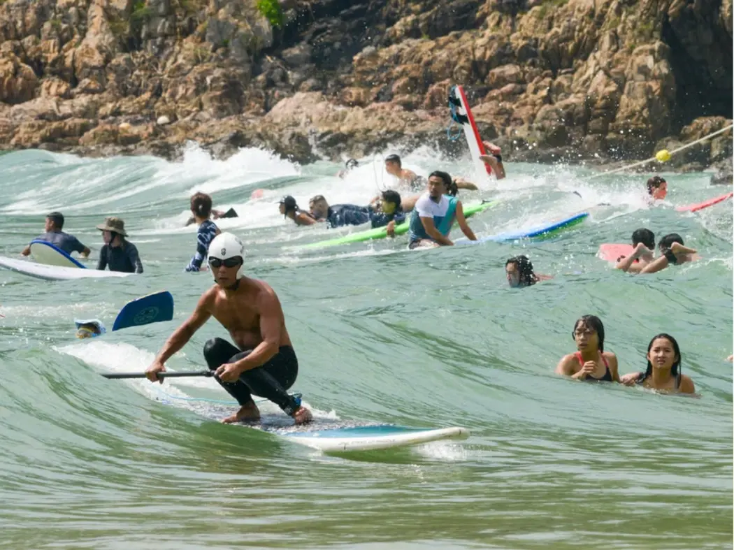 surfing in Big Wave Bay